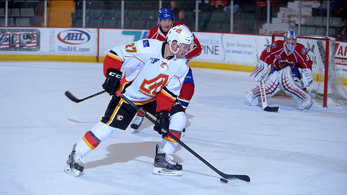 FLAMES SEND BULLDOGS TO DOGHOUSE IN 3-2 OT WIN