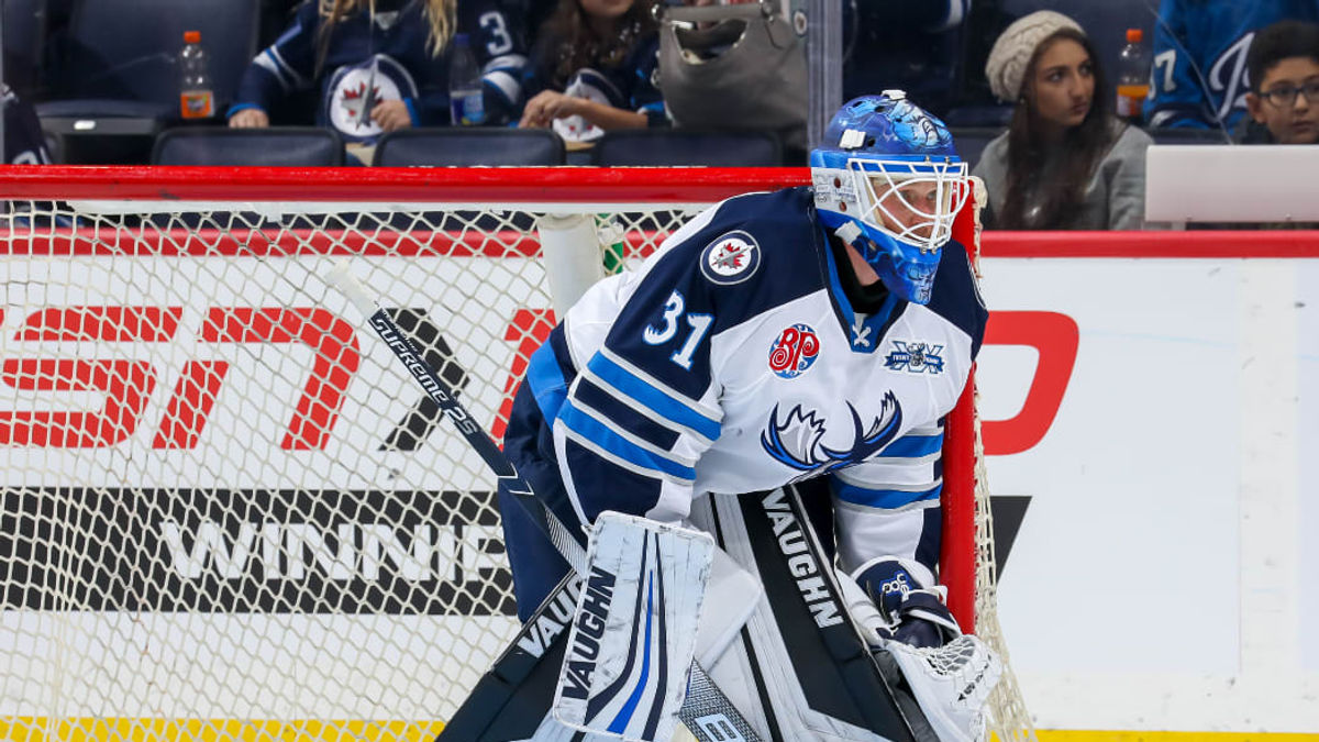 Manitoba Assigns Carlson to Icemen; Recall Outhouse